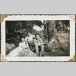 Three men sitting by a waterfall (ddr-densho-321-199)