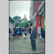 Henri Takahashi on street leading to Oura Church, Nagasaki (ddr-densho-426-496)