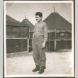 Soldier in front of tents (ddr-densho-201-515)