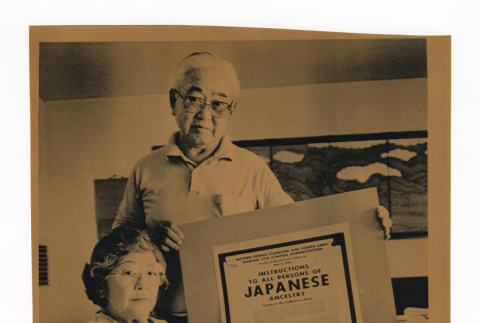 Al and Mary Tsukamoto with copy of executive order 9066 (ddr-csujad-52-30)