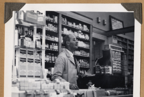 Man behind a cash register (ddr-densho-542-96)