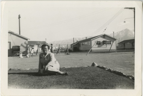 Woman sitting on a lawn (ddr-manz-7-22)