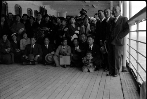 Group photo of passengers on board ship (ddr-densho-426-2007)