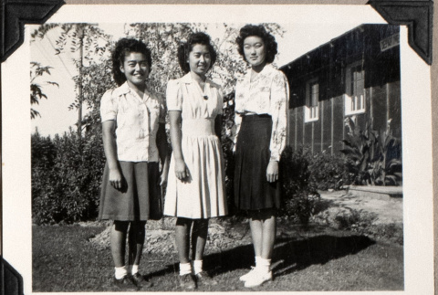 Three women standing outside barracks (ddr-densho-587-16)