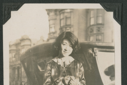 woman next to car (ddr-densho-378-541)