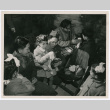 Italians orphans opening Christmas presents with members of the 442nd (ddr-densho-1007-262)