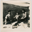 Henri Takahashi (l), unknown women and Tomoye (Nozawa) Takahashi sitting in a field (ddr-densho-426-1944)
