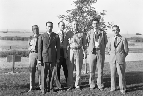 Men standing in front of barracks (ddr-fom-1-620)