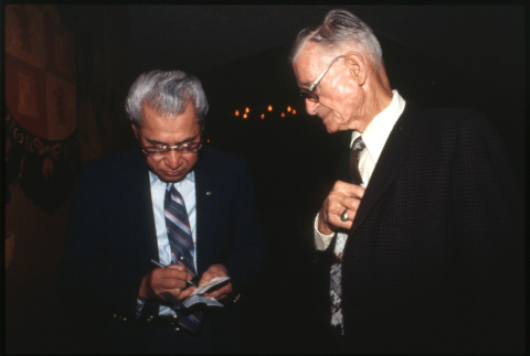 Man writing note (ddr-densho-1007-744)