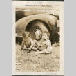 Two babies sitting near a car (ddr-densho-316-24)