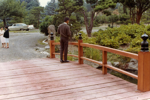 Kay Kubota on the Heart Bridge, Kiyo Kubota in the background (ddr-densho-354-493)