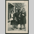 Four women and a man pose on sidewalk (ddr-densho-359-177)