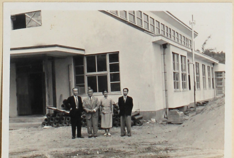 Four people outside a building (ddr-densho-433-732)