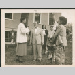 Group standing on lawn talking (ddr-densho-293-148)