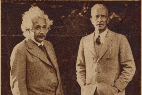 Albert Einstein standing with a man (ddr-njpa-1-284)