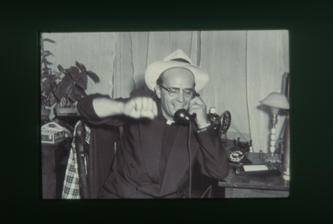 (Slide) - Image of priest talking on phone (ddr-densho-330-82-master-b63ba01647)
