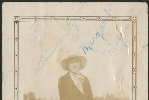 Woman in hat and white pants in field (ddr-densho-316-393)
