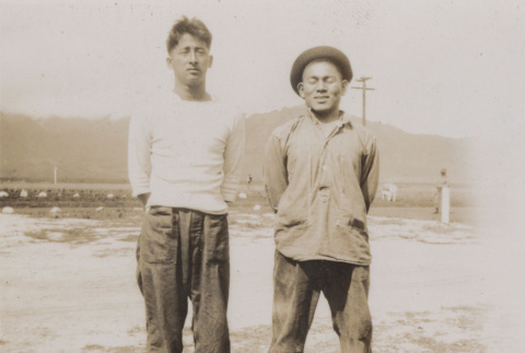 Two men standing (ddr-janm-17-57)