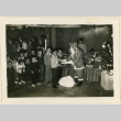 Santa Claus hands out gifts to children (ddr-densho-37-1304)