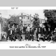Group of men posing for photo outside house (ddr-ajah-6-189)