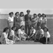 Ben Kuroki with a group of women at Minidoka (ddr-fom-1-365)