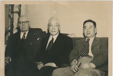 Three men seated on a couch (ddr-densho-296-87)