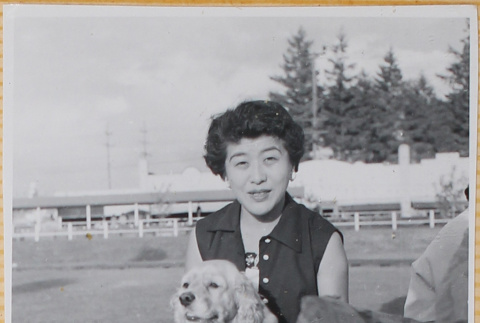 Woman holding dog (ddr-densho-522-327)
