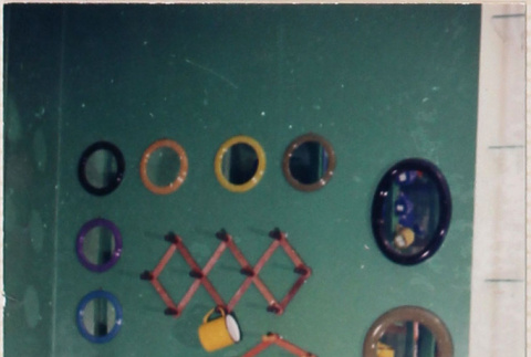 Display of small mirrors and wall racks (ddr-densho-426-1207)