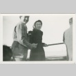 Guyo Tajiri and a man holding onto a rope railing (ddr-densho-338-294)
