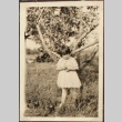 Girl in front of an apple tree (ddr-densho-259-12)
