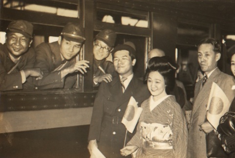 Katsutaro Kouta, Yaso Saijo and Ranko Edogawa posing with soldiers (ddr-njpa-4-648)