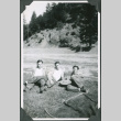 Three men lying on grass (ddr-ajah-2-374)