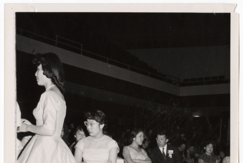Convention attendees sit by a dance floor (ddr-sbbt-3-150)