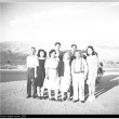 Group of Japanese Americans in front of a car (ddr-densho-153-294)