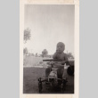 A toddler sitting on a child's bike (ddr-densho-315-8)