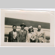 Henri Takahashi on right, with Tomoye (Nozawa) Takahashi and two unknown men on board ship (ddr-densho-426-1991)