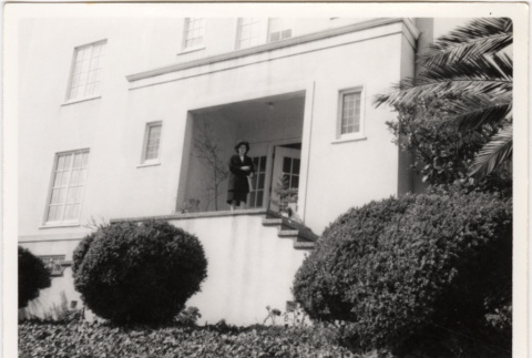 Tomoye Takahashi in front of house (ddr-densho-426-93)