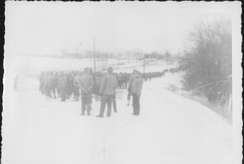 Large group of men standing in snow (ddr-densho-434-386)