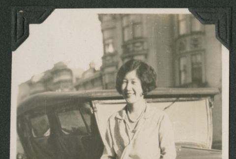 woman next to car (ddr-densho-378-542)