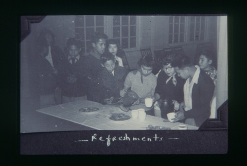 (Slide) - Image of group of boys around table in Maryknoll (ddr-densho-330-128-master-1c2c01eaf1)