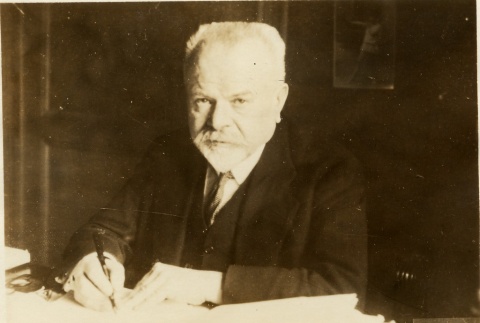 Marcel Regnier writing at his desk (ddr-njpa-1-1457)