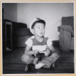 William Shiomi sitting on floor (ddr-densho-522-252)