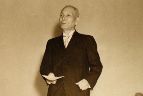 Takie Okumura reading a speech (ddr-njpa-4-1936)