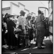Japanese Americans boarding bus (ddr-densho-151-147)