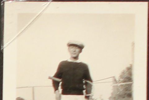 Nisei man with tennis racquet (ddr-densho-259-420)