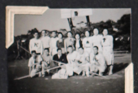 Group photo of 15 in sports uniforms (ddr-densho-468-437)