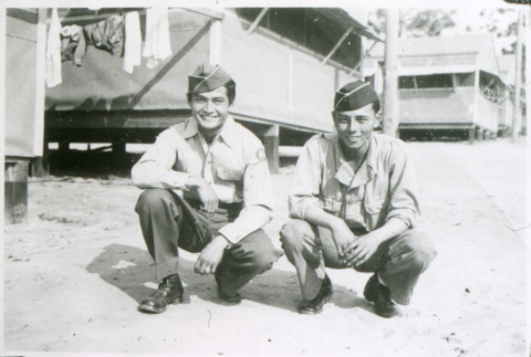 William Kochiyama and one other soldier squatting (ddr-densho-1007-819)