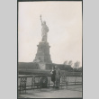 Couple in front of statue of liberty (ddr-densho-523-160)