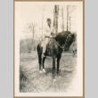 Bill Iino on a horse (ddr-densho-368-497)