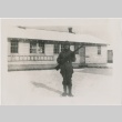 A soldier posing with a rifle in the snow (ddr-densho-273-10)